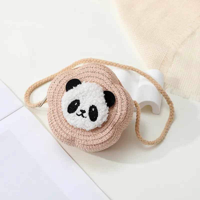 Round woven bag with a panda face design on a light background